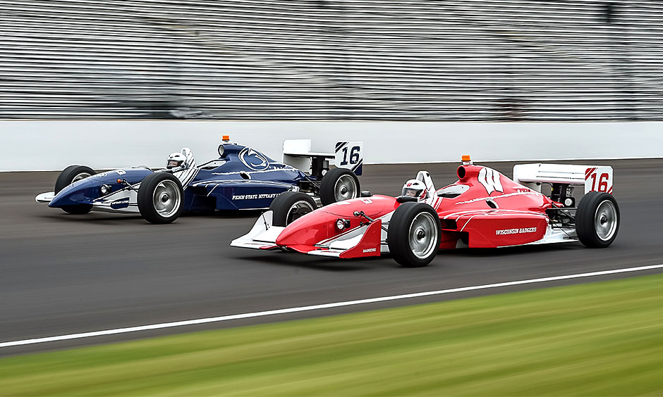 Cars representing Wisconsin and Penn State on famed IMS oval