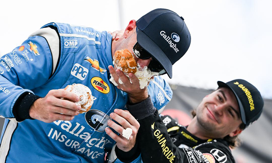 Scott McLaughlin and Colton Herta celebrating on the podium in Milwaukee.